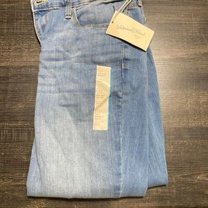 Mid rise light blue jeans.